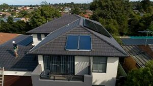 Residential house with solar panels on the roof after being installed by Solahart.